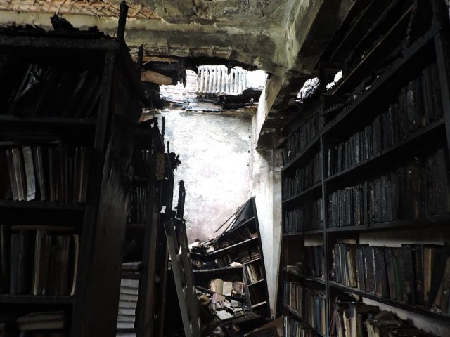 A library burnt in the college destroyed in Kharkiv in the night of August 2, 2022.