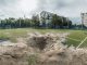 A crater on a football field in North Saltivka, Kharkiv.