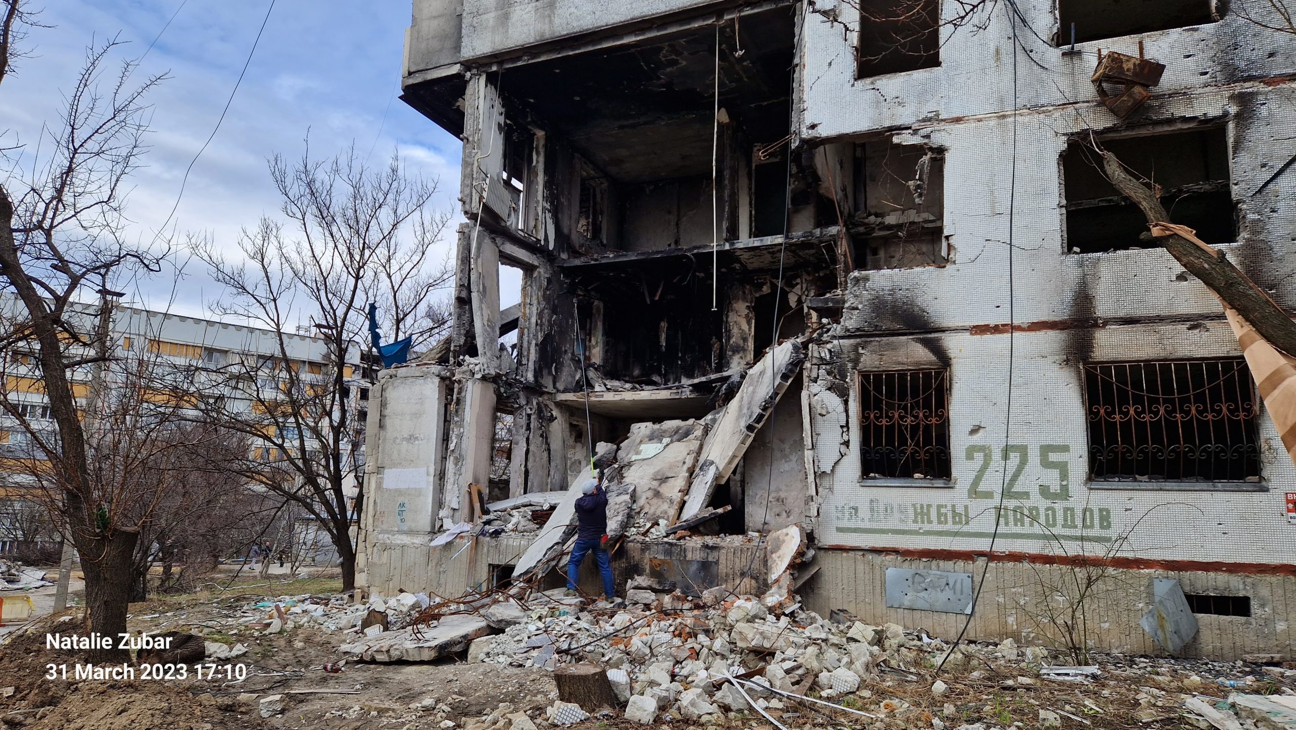 A destroyed apartment building in North Saltivka, Kharkiv with the remnants of the address on the wall, which is translated as "Friendship of the Peoples Street #225". Photo was taken on March 31, 2023 by Nataliya Zubar.